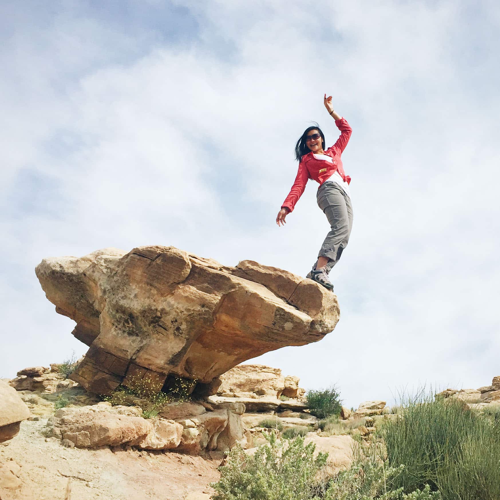 Linda Ly posing on a sandstone rock formation